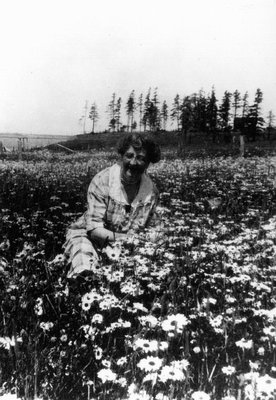 Lucy Maud Montgomery in a field of flowers, ca.1935