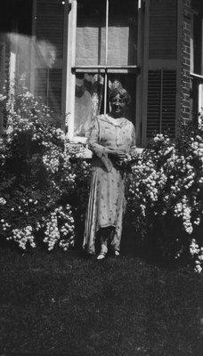 Lucy Maud Montgomery in her garden at Norval, ON. 1932.