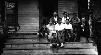 Group on porch at Roselawn with Chester, Stuart & Ewan Macdonald, ca.1920.  Bala. ON.