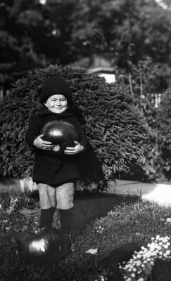 Chester with pumpkin, age 4, Oct. 1916.  Leaskdale, ON.