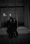 Chester Macdonald sitting on window ledge with woman friend.