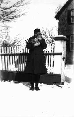 Chester holding cat in the snow, Leaskdale, ON.