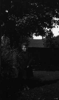 Chester standing under a tree, Leaskdale, ON.