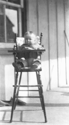 Chester in high chair.