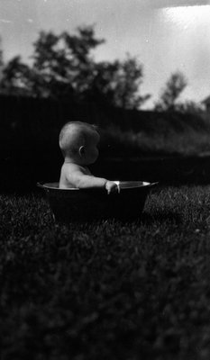 Stuart Macdonald in tub in backyard, age 10 months, ca.1916.  Leaskdale, ON.