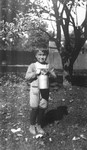 Stuart with Paddy the cat in bucket, age 5 1/2 years, ca.1921.  Leaskdale, ON.