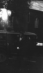 Stuart, standing beside car, 1933, Norval, ON.