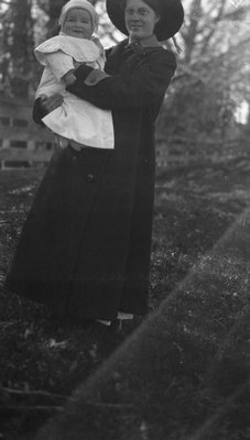 Stuart as a baby being held by a woman, Leaskdale, ON.