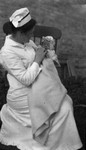 Nurse Bernard (?) with newborn Stuart, ca.1915.  Leaskdale, ON.