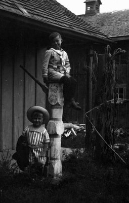 Chester & Stuart, Chester sitting on top of a water pump, Leaskdale, ON.