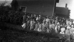 Annual Auxiliary picnic with Lucy Maud Montgomery in centre of group, ca.1926.  Leaskdale, ON.