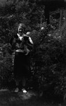 Unidentified young woman holding 2 cats, ca.1940 (?).  Toronto, ON.