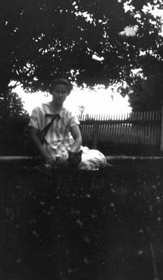 Woman (unidentified) sitting with cat.