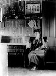 Lucy Maud Montgomery seated in kitchen of Leaskdale Manse, Leaskdale, ON.