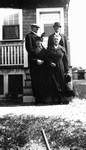 Unidentified men and women standing on steps.  Braintree, Mass.