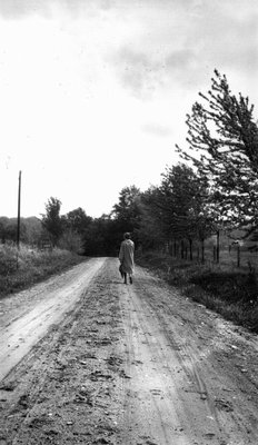 Woman (unidentified) on dirt road near Norval, ON, ca 1926