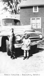 Bonnie Carleton by a Car, circa 1940