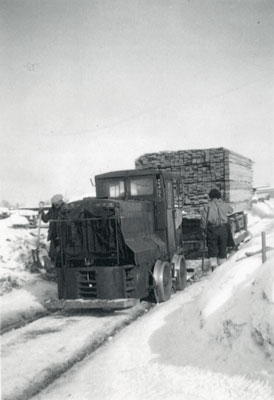 Moving Lumber by Railroad with a Pick-Up Truck, circa 1920