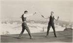 Two Waterloo College students fencing on the roof of Willison Hall