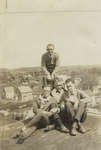 Four Waterloo College students on the roof of Willison Hall