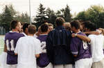 Wilfrid Laurier University men's soccer team in a huddle