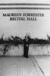 Maureen Forrester standing in front of Aird Centre, Wilfrid Laurier University