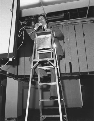 James Wilgar standing on a ladder