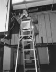 James Wilgar standing on a ladder