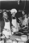 Graham Morbey and Paul Bosch flipping pancakes at Wilfrid Laurier University