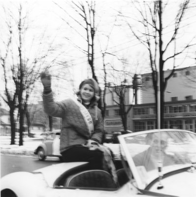 Miss Canadian University Queen Pageant contestant riding in a back of a car
