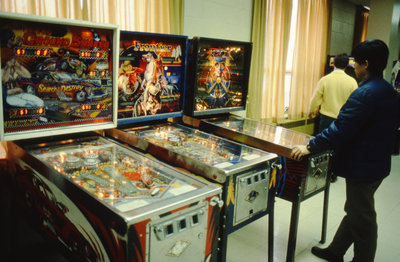 Student playing pinball at Wilfrid Laurier University