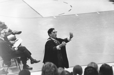 Walter Kemp conducting choir, 1973