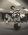 Two students playing pool