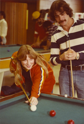 Two students playing pool