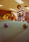 Two students playing pool