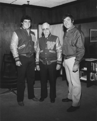 Neale Tayler receiving Lettermen's Club jacket