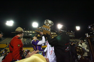 Wilfrid Laurier University football player holding Vanier cup, 2005