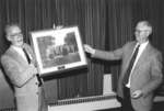 Horace Braden accepting retirement gift from Fred Nichols