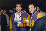 Two men wearing Wilfrid Laurier University varsity jackets