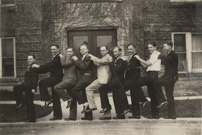 Nine men in front of Willison Hall, 1923