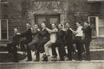 Nine men in front of Willison Hall, 1923