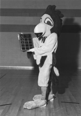 Golden Hawk mascot with award