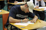 Student writing exam at Wilfrid Laurier University