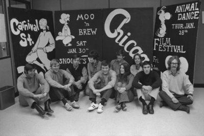 Students in front of Winter Carnival 1971 advertising board