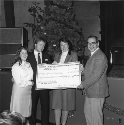 John Weir and Marge Millar accepting a cheque from WLUSU