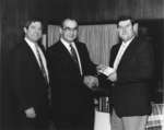 John Weir and Rich Newbrough accepting a donation from Nestlé Enterprises
