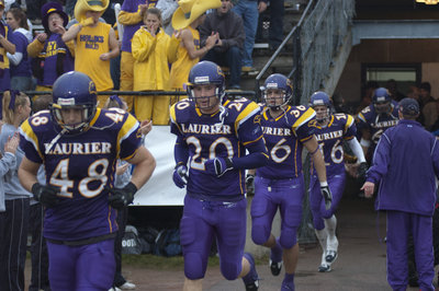 Laurier football team running on field, 2005