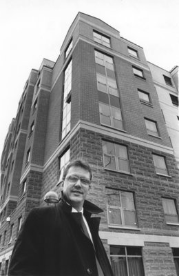 Mike Belanger standing in front of the Bricker Avenue Residence