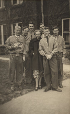 Marion Axford and six Waterloo College students in front of Willison Hall