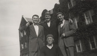 Four Waterloo College freshmen standing in front of Willison Hall